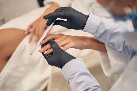 Professional female manicure performed in high quality salonの写真素材
