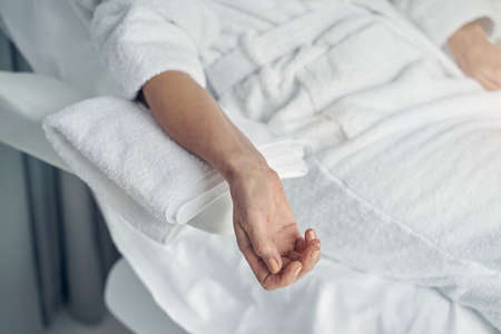 Restful female getting ready for beauty procedureの写真素材