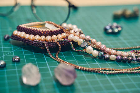 Close up of jewelry necklace in a work placeの写真素材