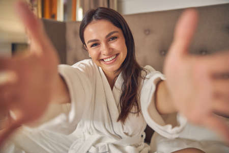 Happy cheerful female smiling at the cameraの写真素材