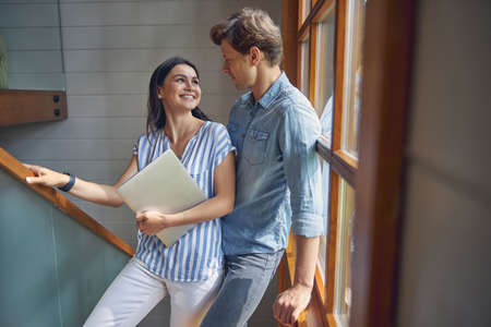 Cheerful lady wearing blouses laughing near the boyfriendの写真素材