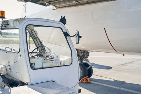 Civil aircraft and an airport ground vehicleの写真素材