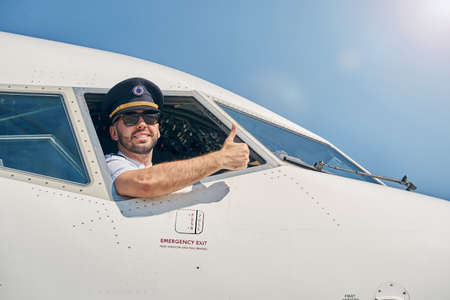 Smiling airman demonstrating his readiness for flightの写真素材