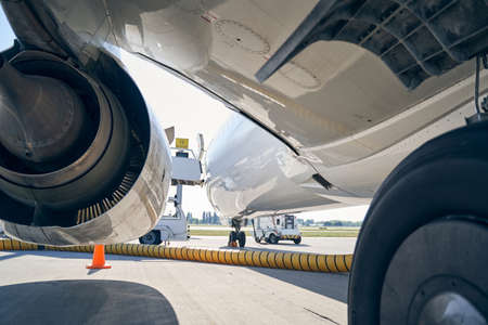 Airplane serviced during the refueling process at the airdrome