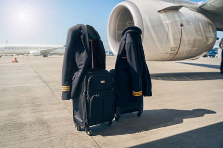 Wheeled pilot cases put on the groundの写真素材