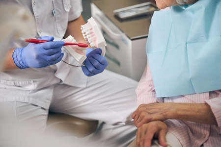 Orthodontist is telling about hygiene in hospital