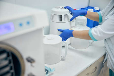 Doctor assisatant using machine in work place