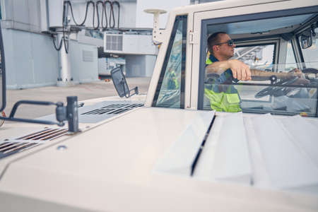 Man in sunglasses sitting in a truckの写真素材