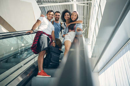 Laughing international team going to traveling togetherの写真素材
