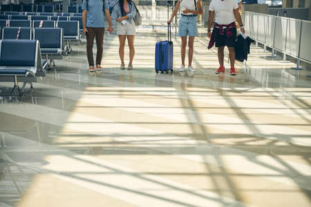 Hall with four tourist in the international airport