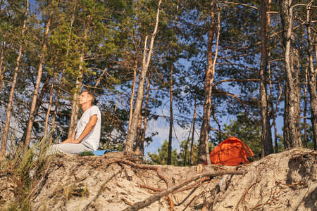 Happy mature man spending holiday in forestの写真素材