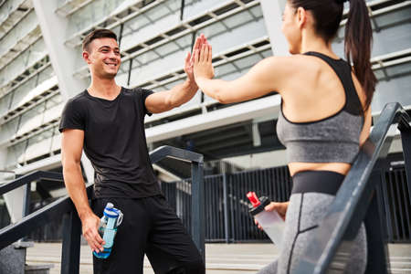 Cheerful sporty couple going to training togetherの写真素材