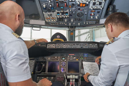Aircraft cockpit with two colleagues in it