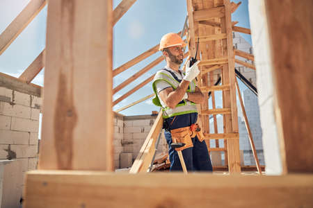 Delighted male person enjoying work on sunny day