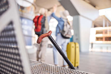 Aged tourist couple in casual clothes standing outsideの写真素材
