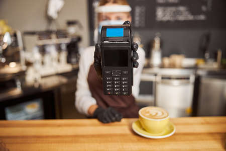 Contactless payment preventing in cafe or coffee shopの写真素材