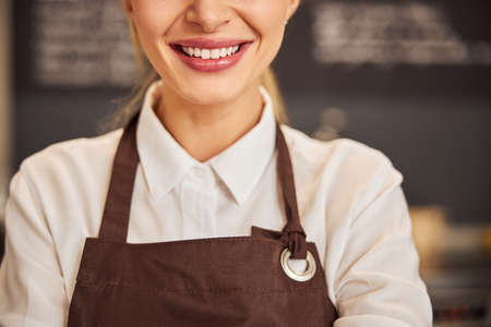 Elegant Caucasian woman smiling ahh the photo camera in the indoorsの写真素材