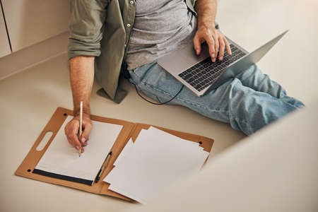 Busy gentleman working remotely from his home