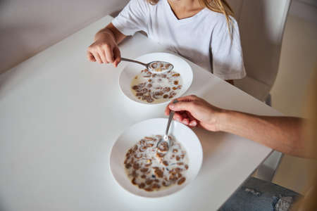 Picture of tasty meal of mother and daughter in home at the quarantine time