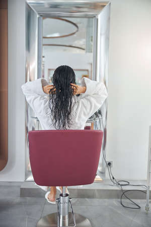 Back photo of a customer in a chairの写真素材