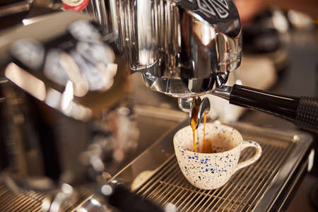 Delicious espresso made in the coffee house in modern machineの写真素材