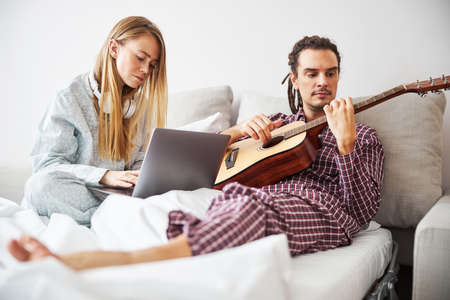 Beautiful young couple spending time together at home