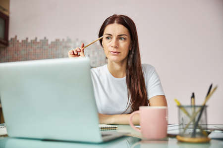 Nervous businessperson thinking over a job issue