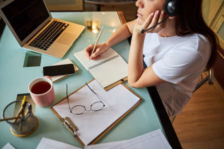 Woman is daydreaming during her working hours
