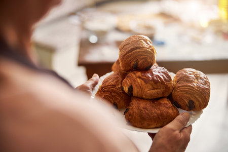 Selective focus photo of plate with baked goodsの写真素材