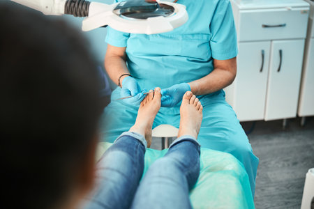 Patient visiting chiropodist podiatrist in beauty centerの写真素材