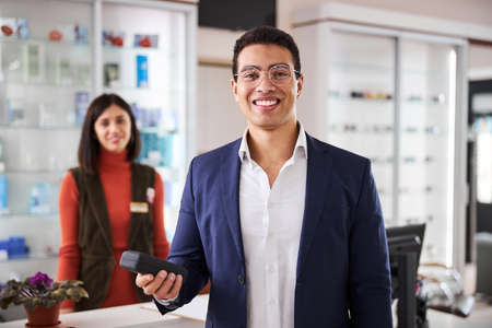High-spirited customer holding a spectacle case in one handの写真素材
