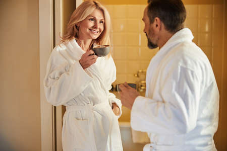 Amicable woman having tea with her boyfriendの写真素材