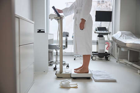 Spa client measuring her muscle mass and a metabolic rateの写真素材