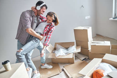 Couple enjoying the partner dance in their new home