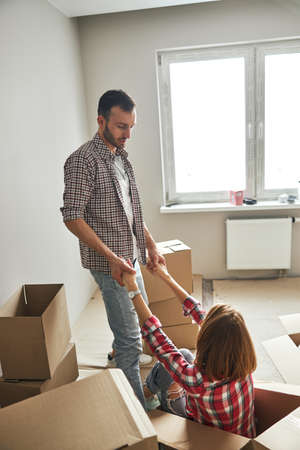 Loving young man helping the woman upの写真素材