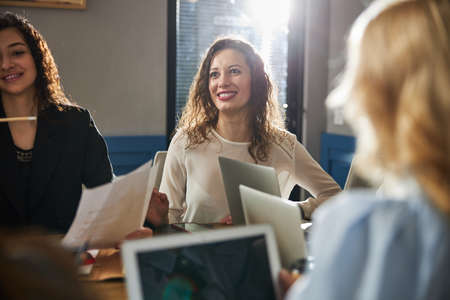 Creative team discussing business project during meeting in officeの写真素材