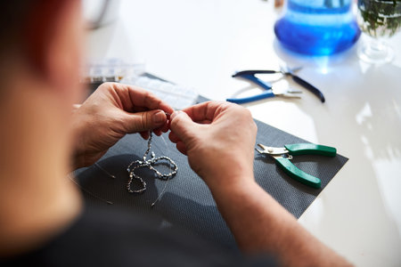 Male jeweler crafting a new jewelry item