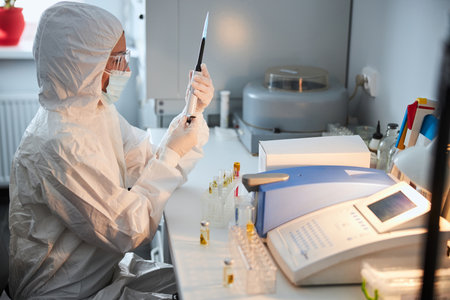 Serious researcher examining the assembled lab tool in her hands