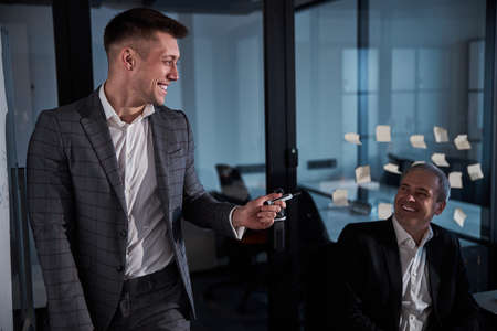 Cheerful business colleagues working in modern officeの写真素材
