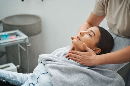 Young woman napping during an anti-wrinkle treatmentの写真素材