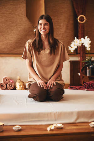 Woman feeling happy before her massage in salonの写真素材