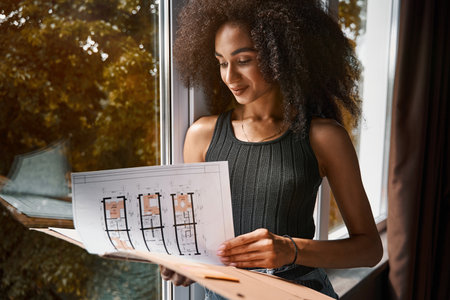 Contented architect feeling satisfied with her work