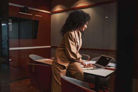 Happy businesswoman working in the conference hallの写真素材