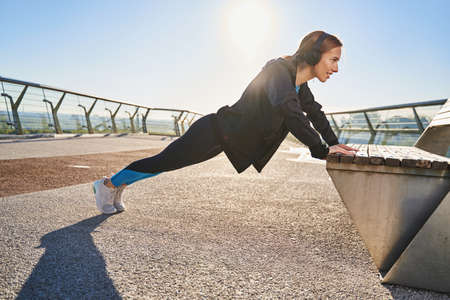 Young female training core in open air