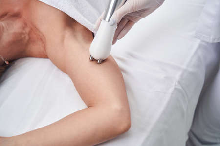 Professional doing beauty procedures for lady bodyの写真素材