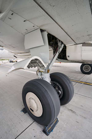 Landed civil aircraft parked on the concrete runway