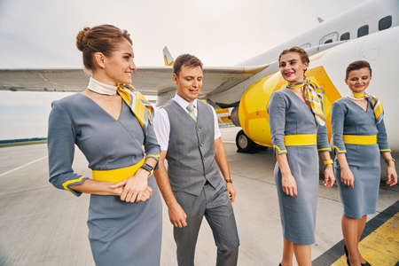 Four elegant aircrew members at the airdrome