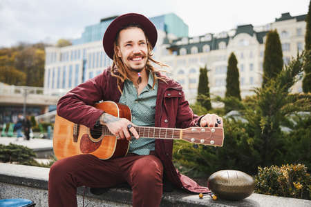 Positive delighted musician enjoying his outdoors performanceの写真素材