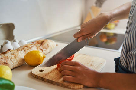 Female cook preparing ingredients for a salad