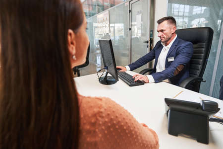 Woman in the office of the customer service specialistの写真素材